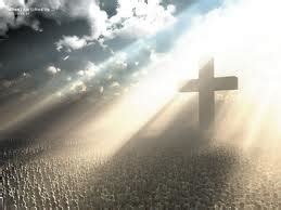 Cross with light breaking through clouds